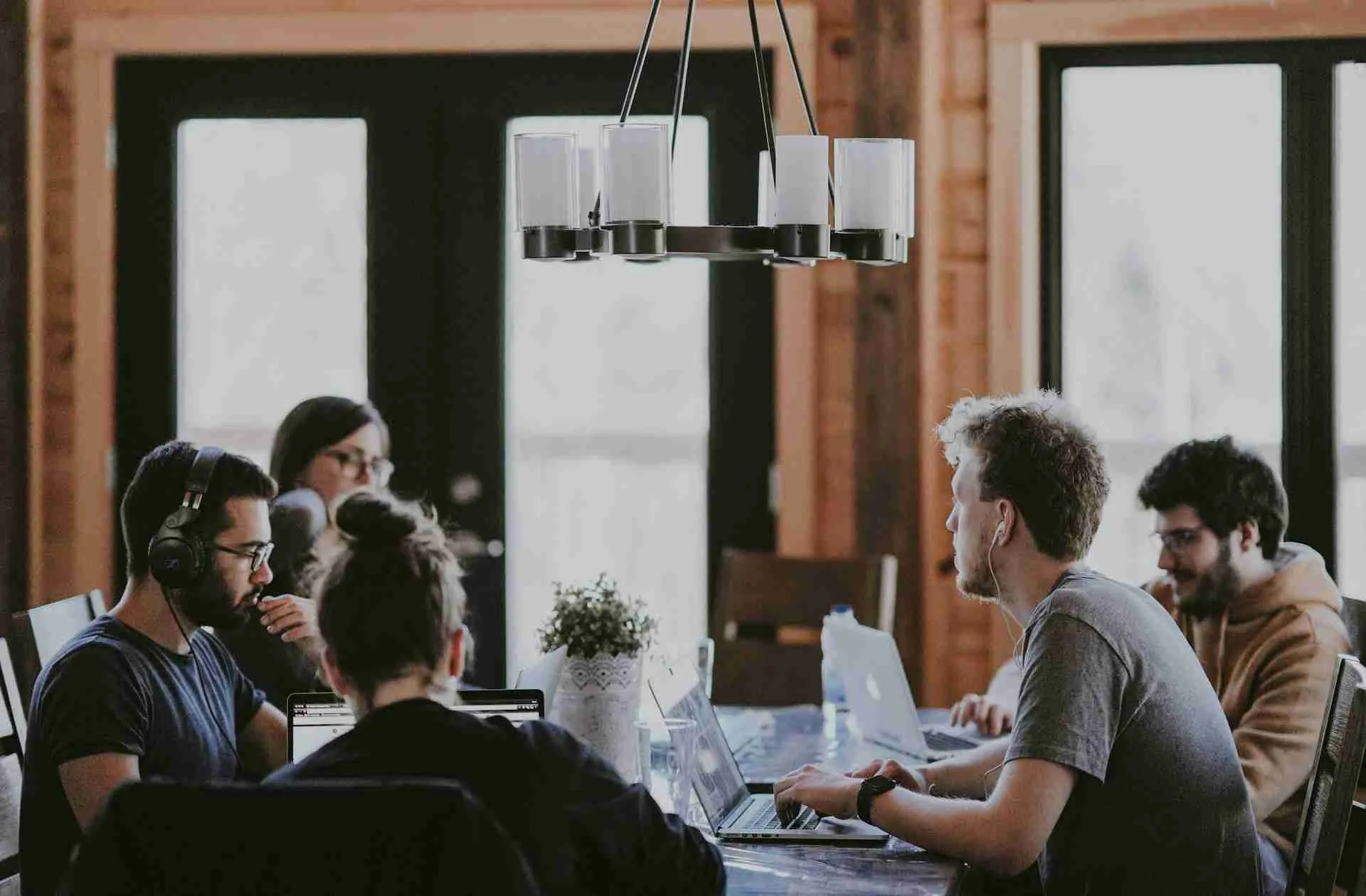 People working separately in a communal workspace